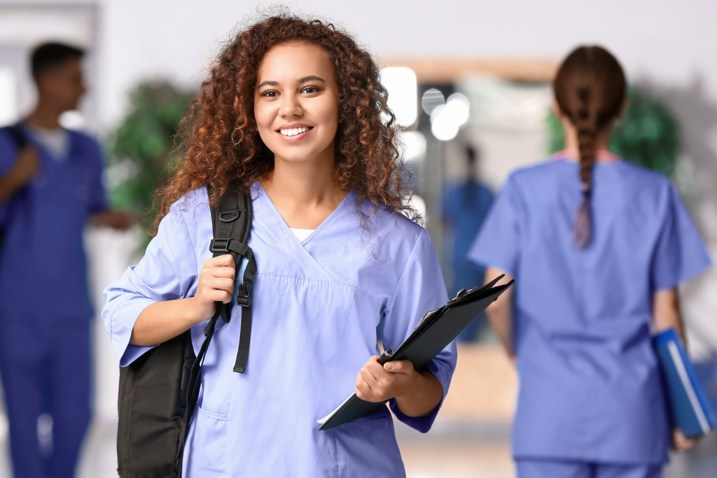 nurse with curly hair and backpack education
