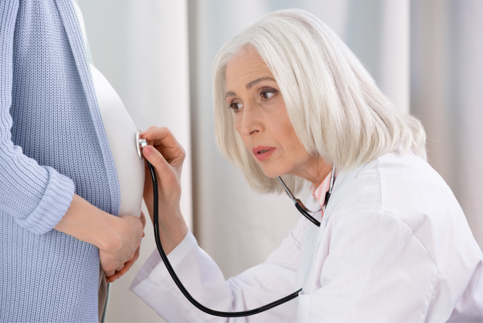 Doctor checking pregnant woman