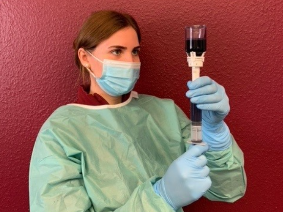 Veterinarian using EQUASHIELD CSTD