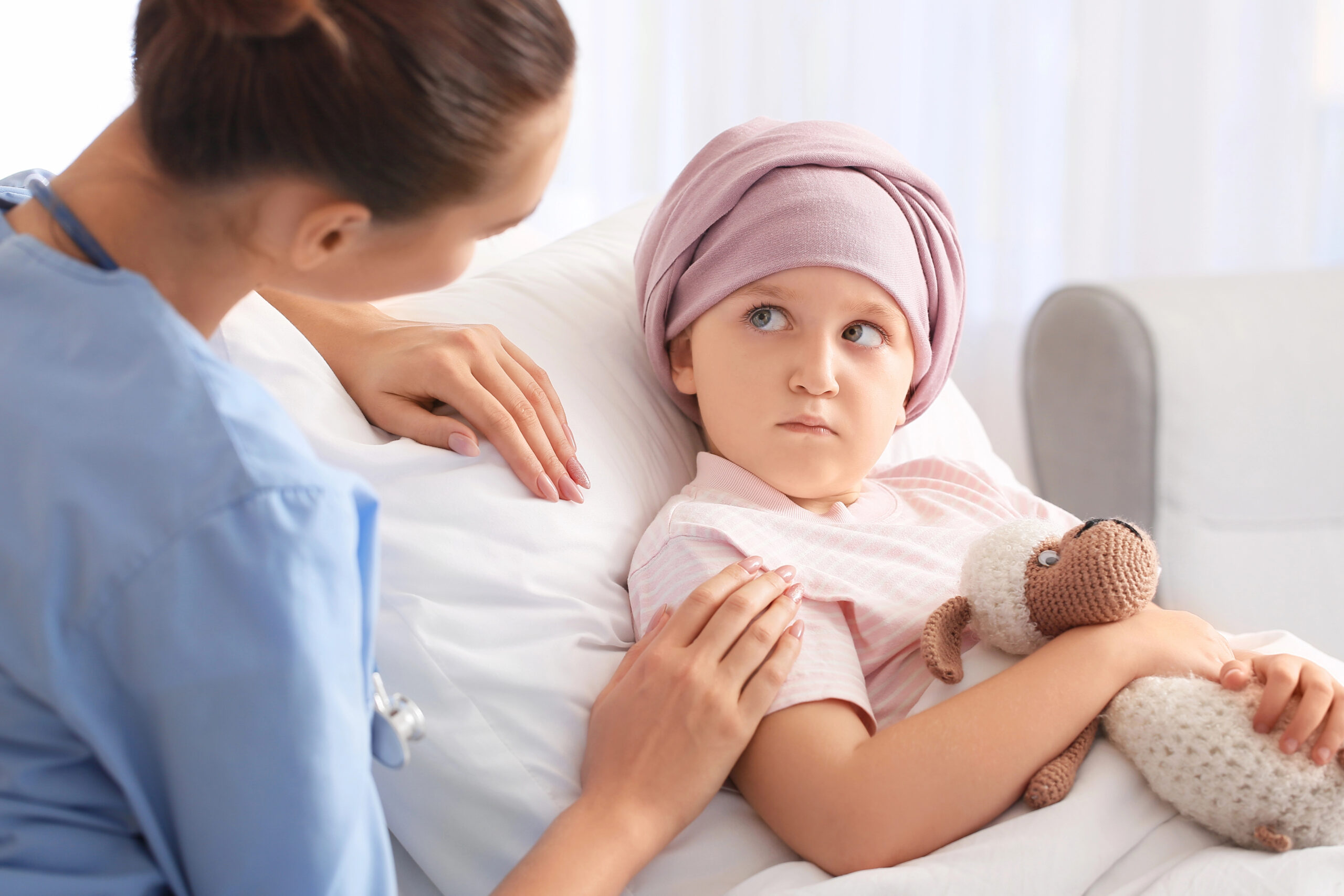 Oncology Nurse and little girl undergoing course of chemotherapy